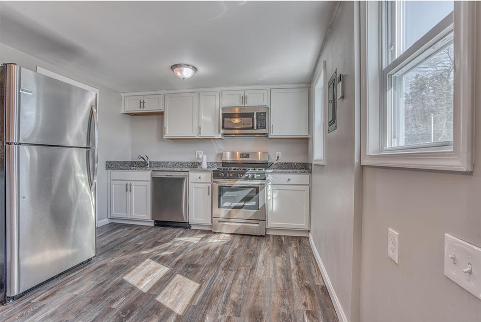 The kitchen before the renovation is outdated and in poor condition